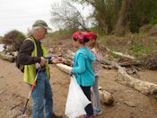 Girl Scouts helping clean up trash.