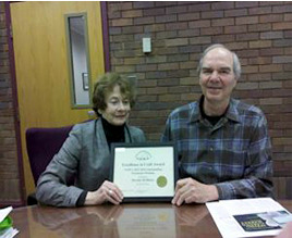 Dorothy McManus and Duncan Hobart with the award